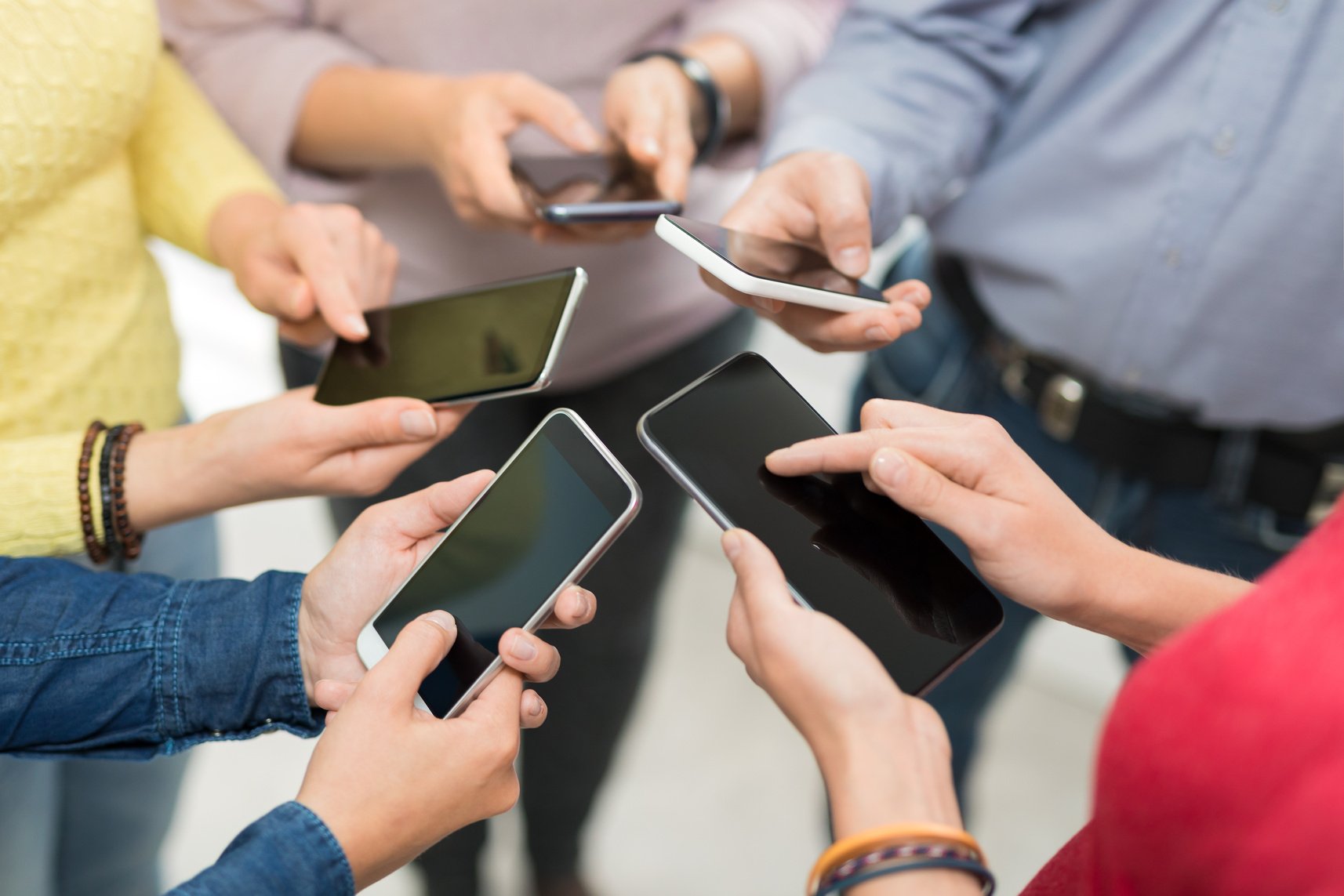 Friends Having Fun Together with Smartphones